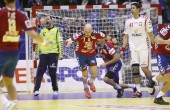 Nikcevic's fast break goal in closing seconds bails out Serbia