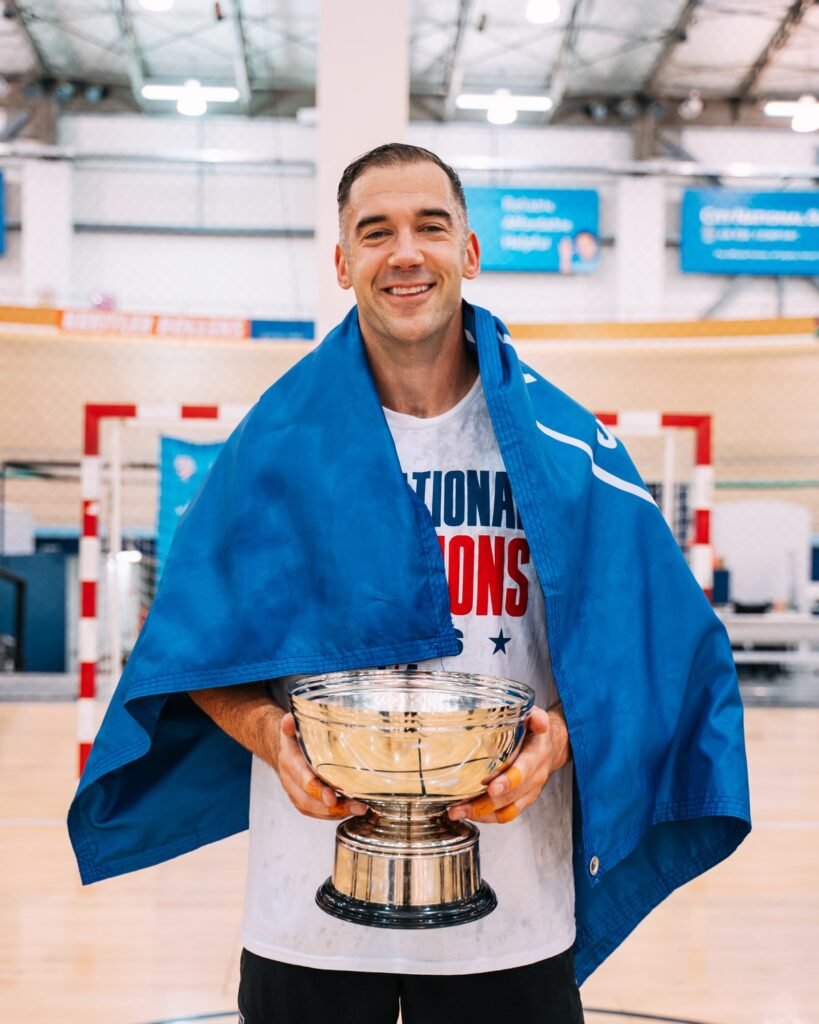 Lewis Howes with the National Championship Trophy